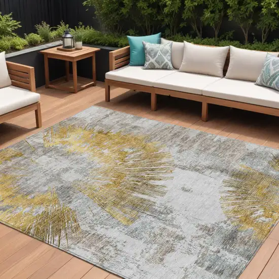 Gold Beige And Ivory Abstract Washable Indoor Outdoor Area Rug Photo 1