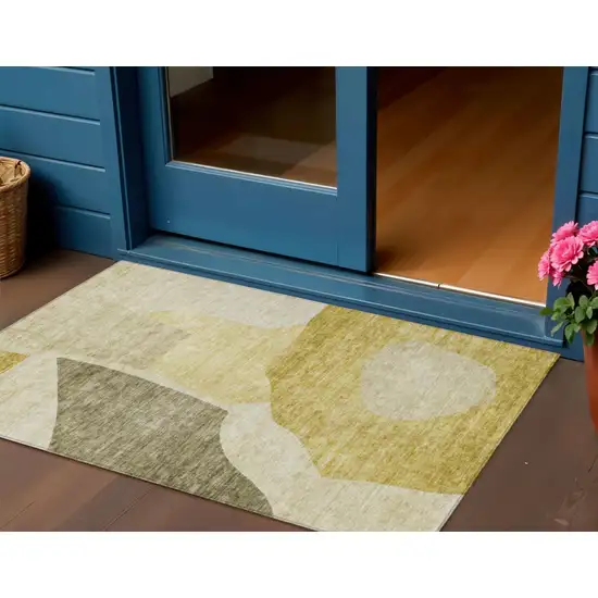 Gold Beige And Wheat Abstract Washable Indoor Outdoor Area Rug Photo 1