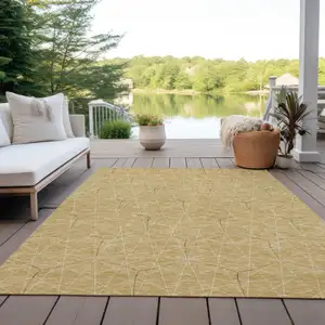 Photo of Gold Black And Beige Geometric Washable Indoor Outdoor Area Rug