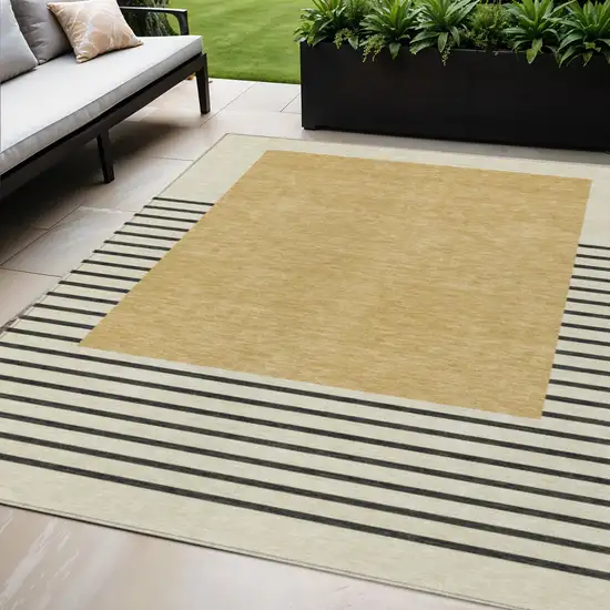 Gold Black And Beige Striped Washable Indoor Outdoor Area Rug Photo 1