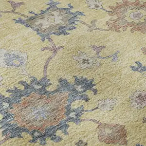 Photo of Gold Blue And Ivory Floral Washable Area Rug With UV Protection