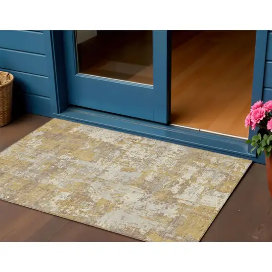 Gold Brown And Beige Abstract Washable Indoor Outdoor Area Rug Photo 1