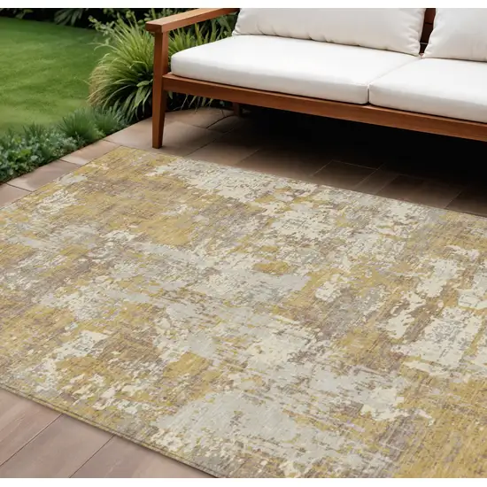 Gold Brown And Beige Abstract Washable Indoor Outdoor Area Rug Photo 1