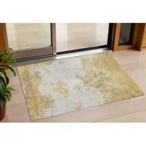Photo of Gold Brown And Beige Abstract Washable Indoor Outdoor Area Rug