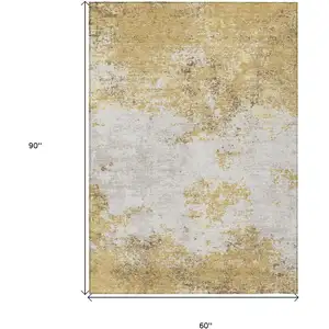 Photo of Gold Brown And Beige Abstract Washable Indoor Outdoor Area Rug