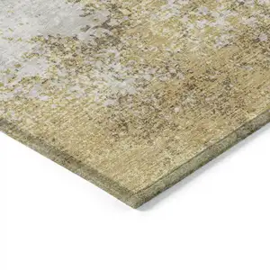 Photo of Gold Brown And Beige Abstract Washable Indoor Outdoor Area Rug
