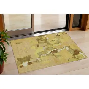 Photo of Gold Brown And Green Abstract Washable Indoor Outdoor Area Rug