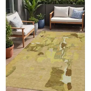 Photo of Gold Brown And Green Abstract Washable Indoor Outdoor Area Rug