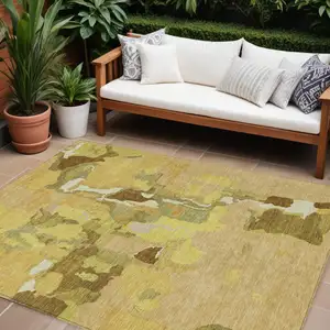 Photo of Gold Brown And Green Abstract Washable Indoor Outdoor Area Rug