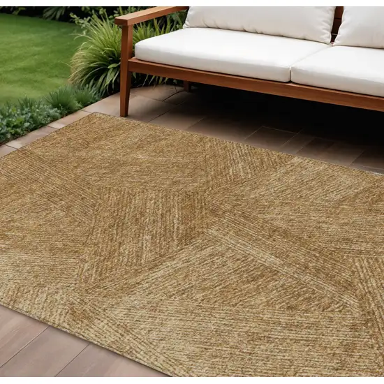 Gold Brown And Ivory Abstract Washable Indoor Outdoor Area Rug Photo 1