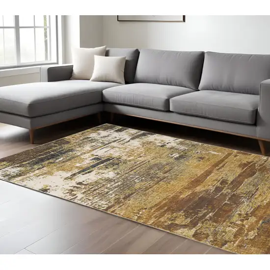 Gold And Beige Abstract Area Rug Photo 1