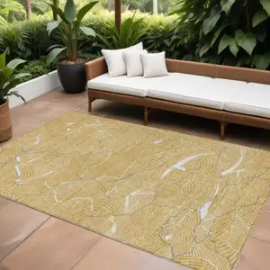 Photo of Gold Charcoal And Ivory Abstract Washable Indoor Outdoor Area Rug