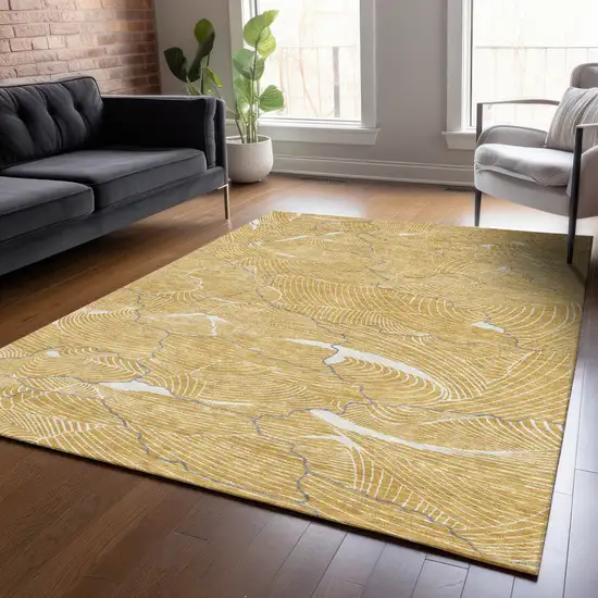 Gold Charcoal And Ivory Abstract Washable Indoor Outdoor Area Rug Photo 9