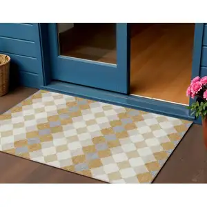 Photo of Gold Copper And Ivory Geometric Washable Indoor Outdoor Area Rug