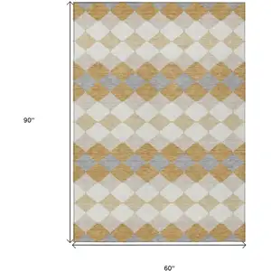 Photo of Gold Copper And Ivory Geometric Washable Indoor Outdoor Area Rug