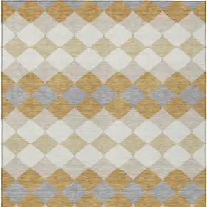 Photo of Gold Copper And Ivory Geometric Washable Indoor Outdoor Area Rug