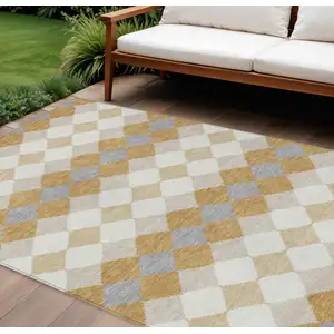 Photo of Gold Copper And Ivory Geometric Washable Indoor Outdoor Area Rug