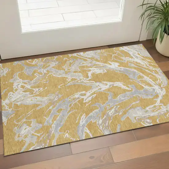 Gold Gray And Beige Abstract Washable Area Rug With UV Protection Photo 1