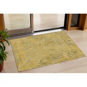 Photo of Gold Gray And Beige Abstract Washable Indoor Outdoor Area Rug