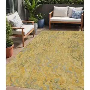 Photo of Gold Gray And Beige Abstract Washable Indoor Outdoor Area Rug