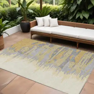 Photo of Gold Gray And Beige Abstract Washable Indoor Outdoor Area Rug