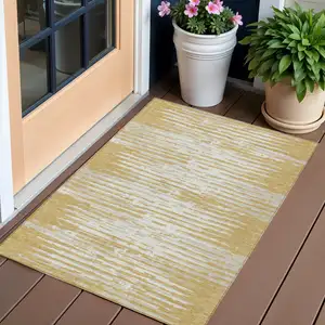 Photo of Gold Gray And Beige Striped Washable Indoor Outdoor Area Rug
