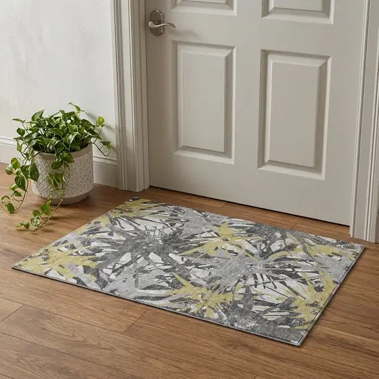 Gold Gray And Charcoal Abstract Washable Area Rug With UV Protection Photo 1