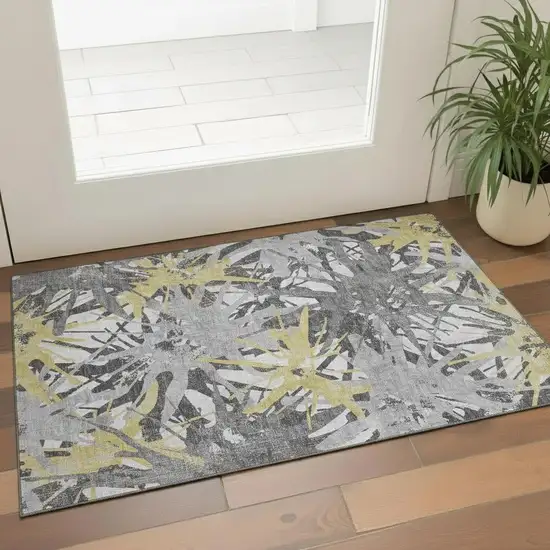 Gold Gray And Charcoal Abstract Washable Area Rug With UV Protection Photo 1