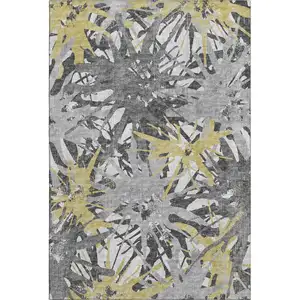 Photo of Gold Gray And Charcoal Abstract Washable Area Rug With UV Protection