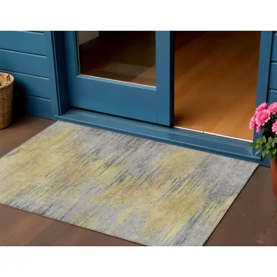 Gold Gray And Charcoal Abstract Washable Indoor Outdoor Area Rug Photo 1