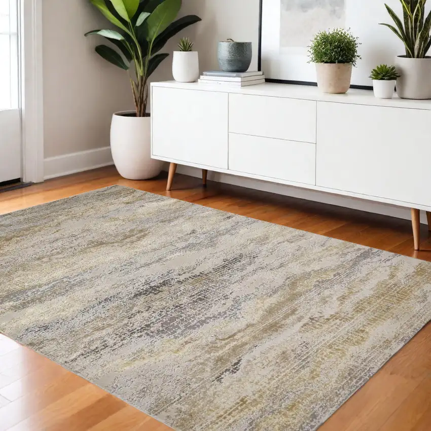 Gold Gray And Ivory Abstract Area Rug Photo 1