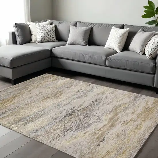 Gold Gray And Ivory Abstract Area Rug Photo 1