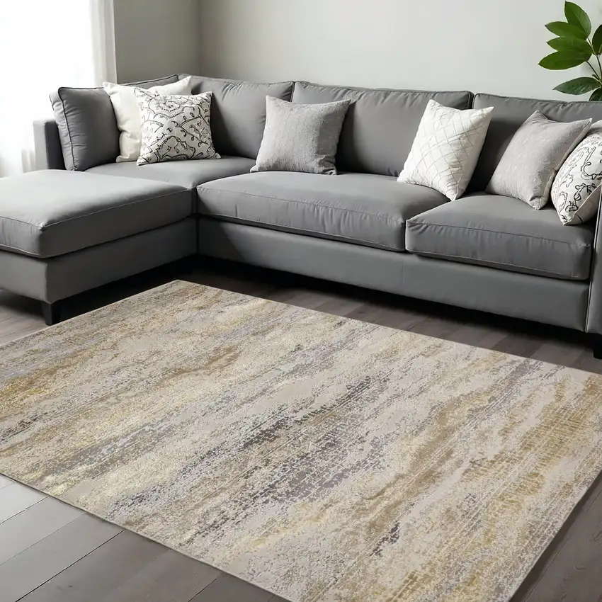 Gold Gray And Ivory Abstract Area Rug Photo 1