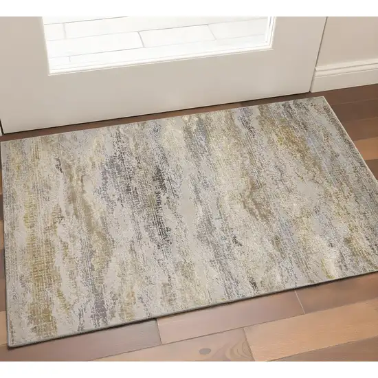 Gold Gray And Ivory Abstract Area Rug Photo 1