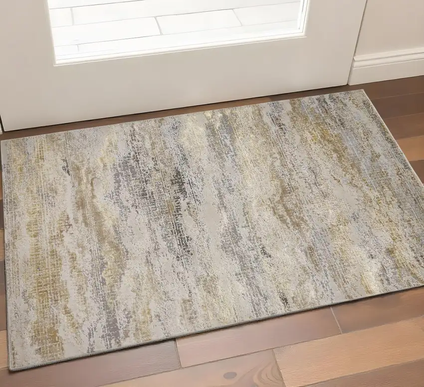 Gold Gray And Ivory Abstract Area Rug Photo 1