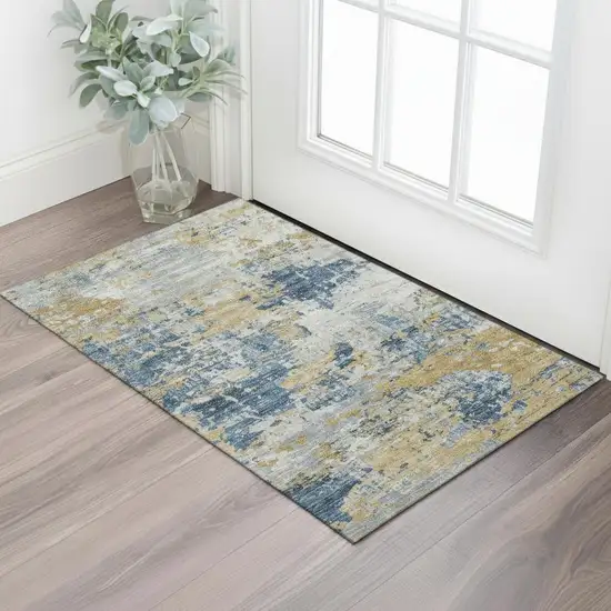 Gold Gray And Ivory Abstract Washable Area Rug With UV Protection Photo 1