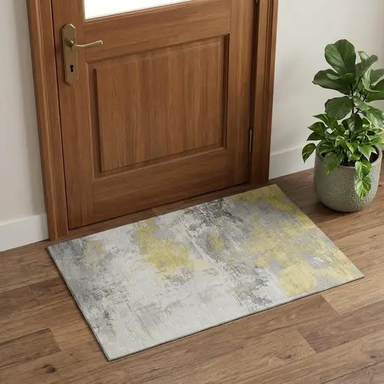 Gold Gray And Ivory Abstract Washable Area Rug With UV Protection Photo 1