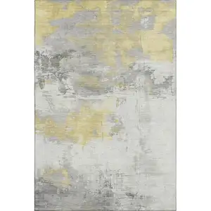 Photo of Gold Gray And Ivory Abstract Washable Area Rug With UV Protection