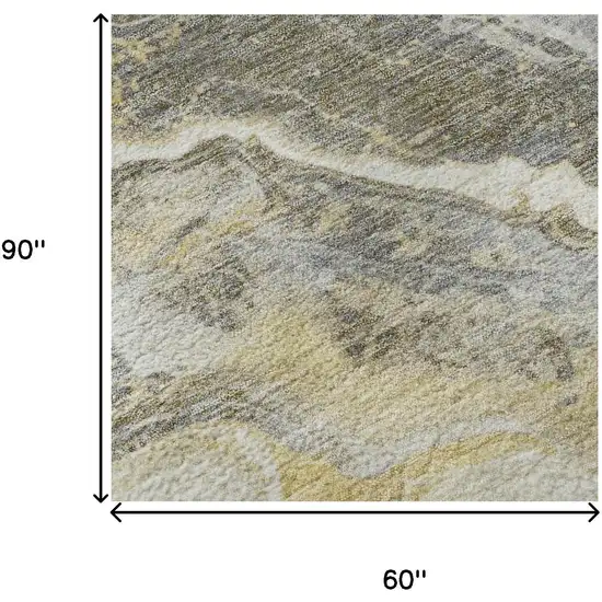 Gold Gray And Ivory Abstract Washable Area Rug With UV Protection Photo 9