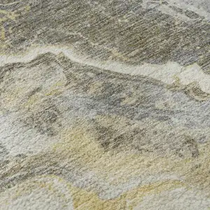 Photo of Gold Gray And Ivory Abstract Washable Area Rug With UV Protection
