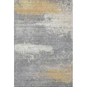 Photo of Gold Gray And Ivory Abstract Washable Area Rug With UV Protection