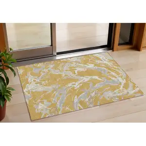 Photo of Gold Gray And Ivory Abstract Washable Indoor Outdoor Area Rug