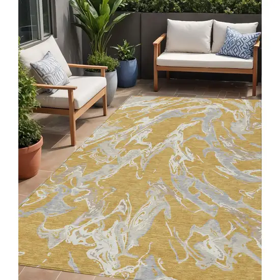Gold Gray And Ivory Abstract Washable Indoor Outdoor Area Rug Photo 1