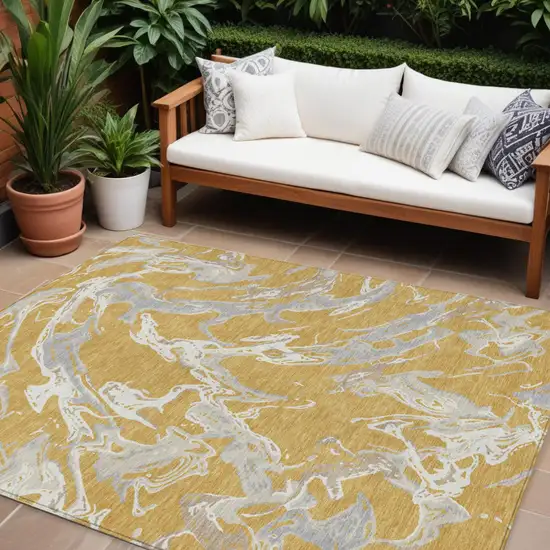 Gold Gray And Ivory Abstract Washable Indoor Outdoor Area Rug Photo 1
