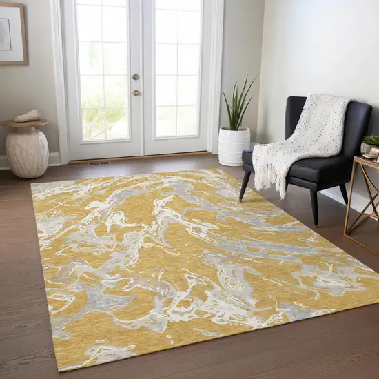 Gold Gray And Ivory Abstract Washable Indoor Outdoor Area Rug Photo 9