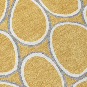 Photo of Gold Gray And Ivory Abstract Washable Indoor Outdoor Area Rug