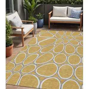 Photo of Gold Gray And Ivory Abstract Washable Indoor Outdoor Area Rug