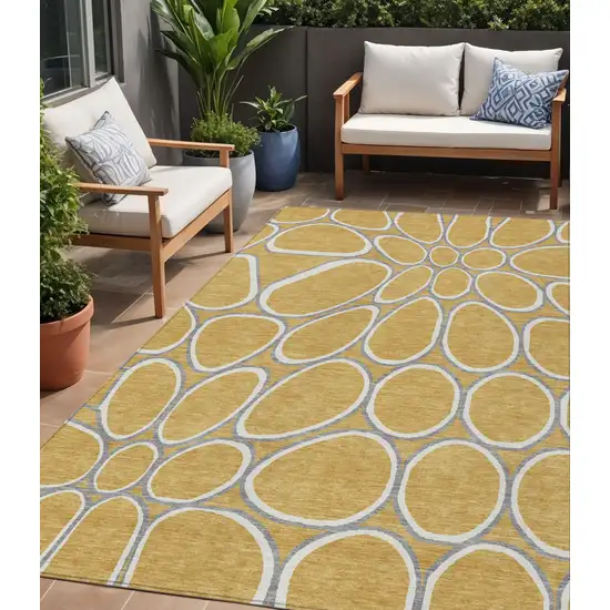 Gold Gray And Ivory Abstract Washable Indoor Outdoor Area Rug Photo 1