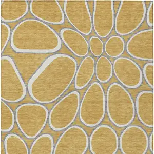 Photo of Gold Gray And Ivory Abstract Washable Indoor Outdoor Area Rug