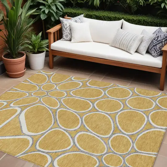 Gold Gray And Ivory Abstract Washable Indoor Outdoor Area Rug Photo 1